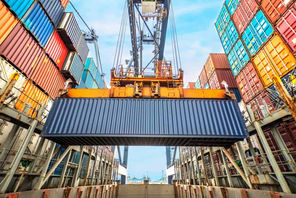 Export import and investing in the UK 1 container ship loading